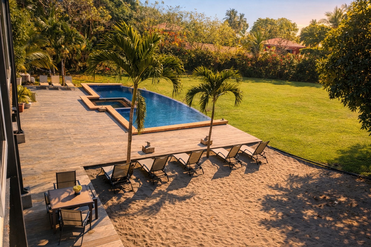 The Villa Esterillos — private beachfront lawn with the Pacific Ocean beyond